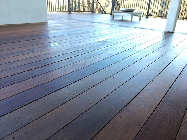 Close-up of freshly stained hardwood deck boards